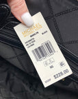 Michael Kors tote bag with a price tag showing $228.00