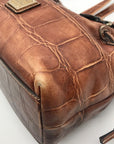 Dooney & Bourke Brown Tortoise Embossed Chiara Drawstring Satchel