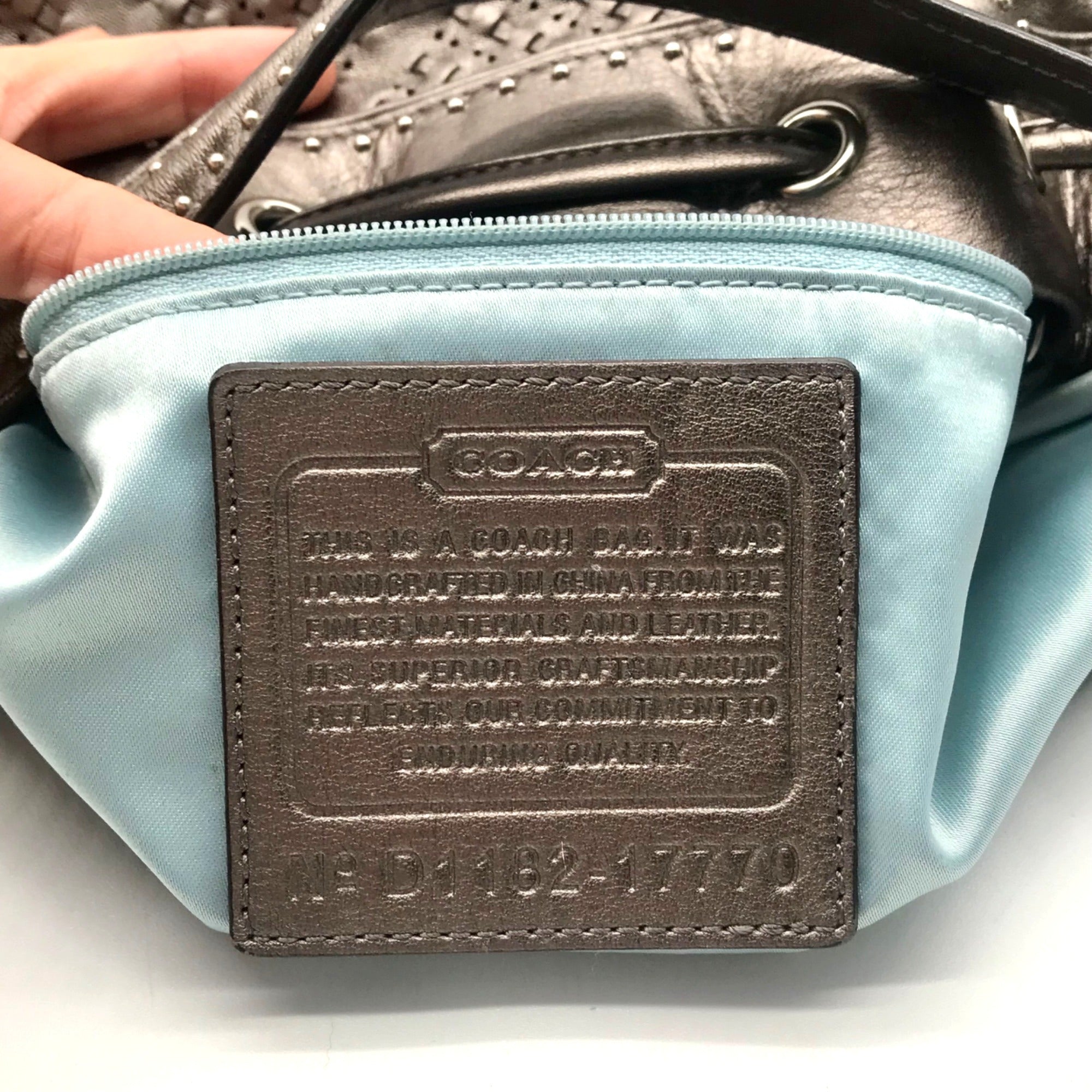 Coach Metallic Perforated Leather Drawstring Shoulder Bag
