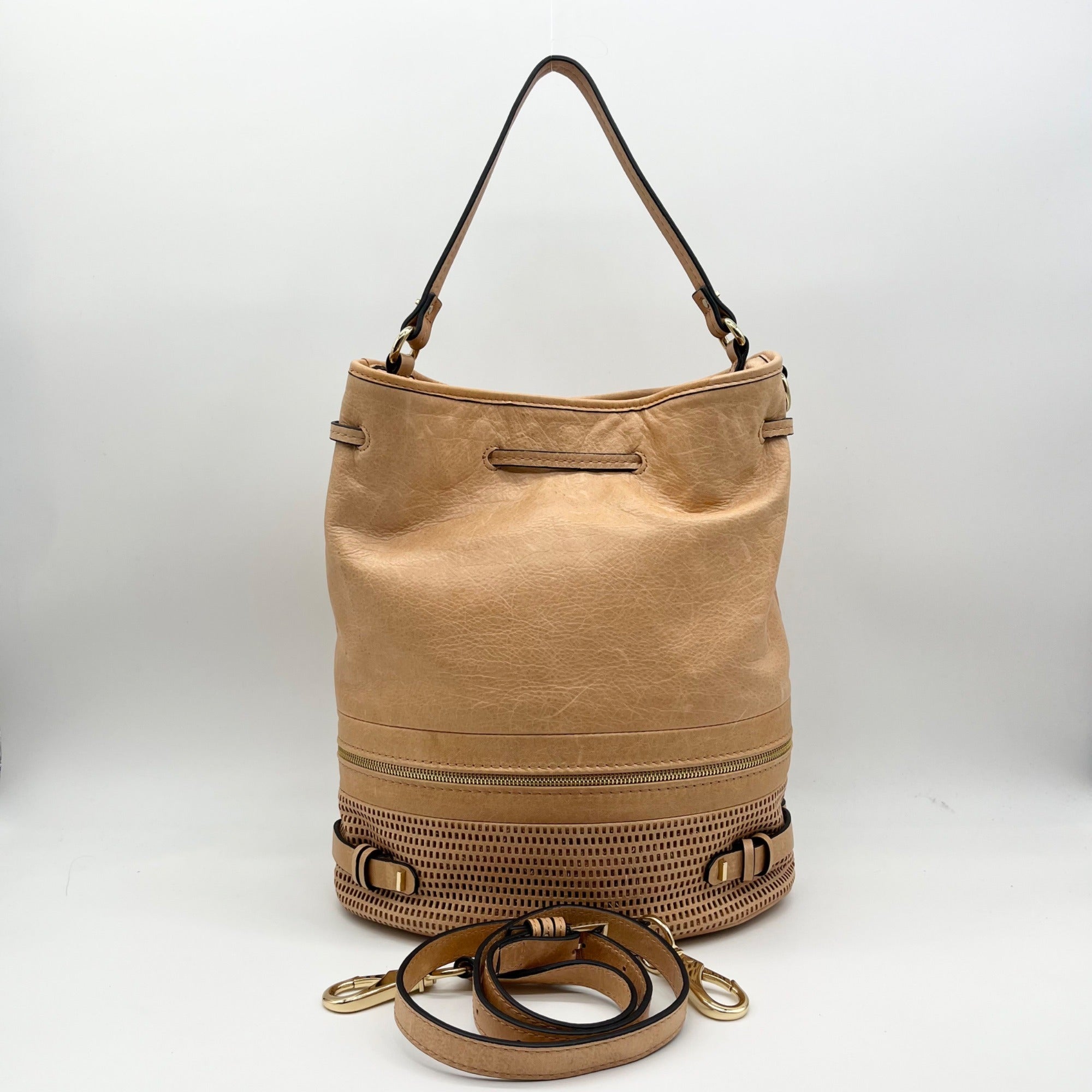 She + Lo Tan Perforated Drawstring Hobo Bag
