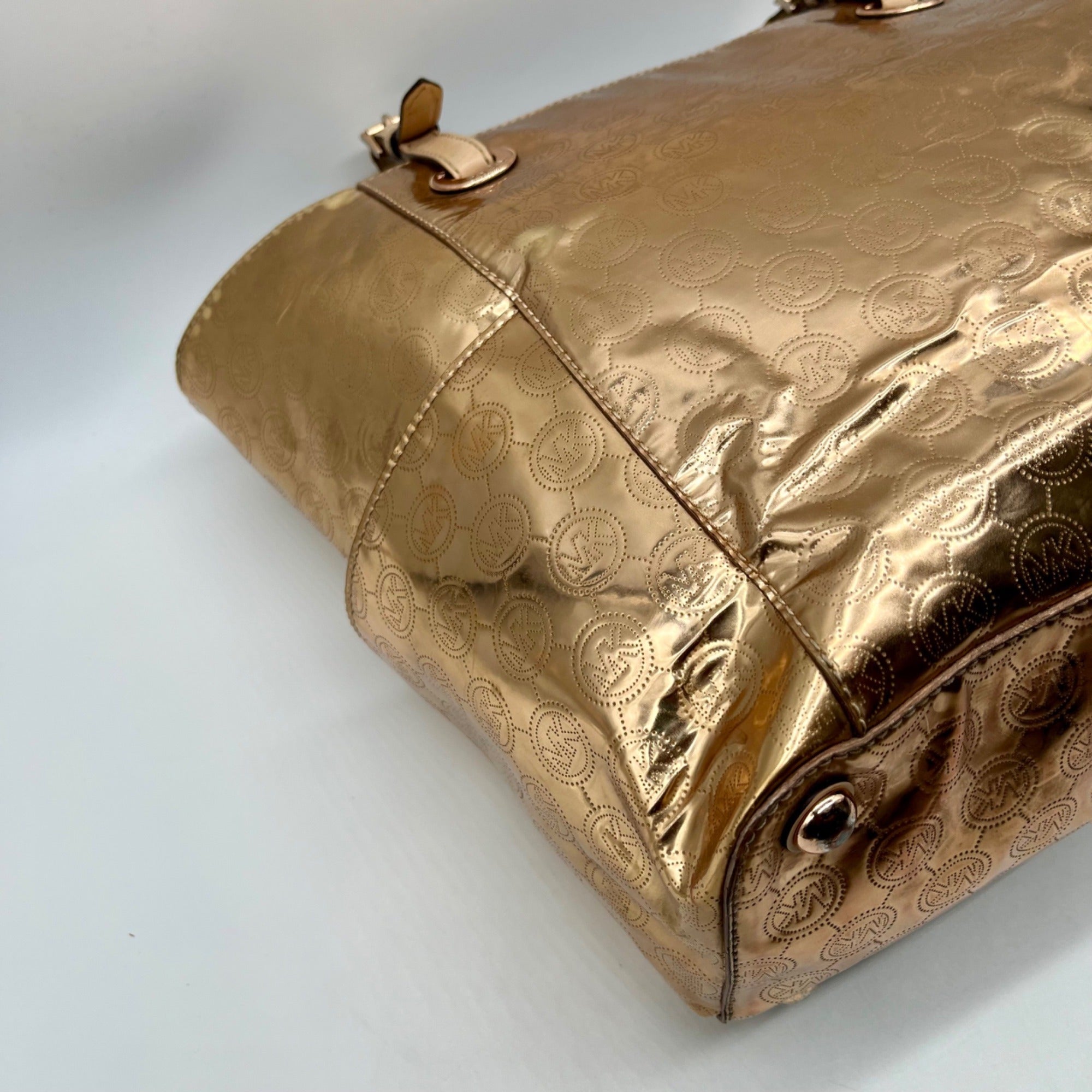 Michael Kors Metallic Rose Gold Embossed Signature Monogram Tote Bag