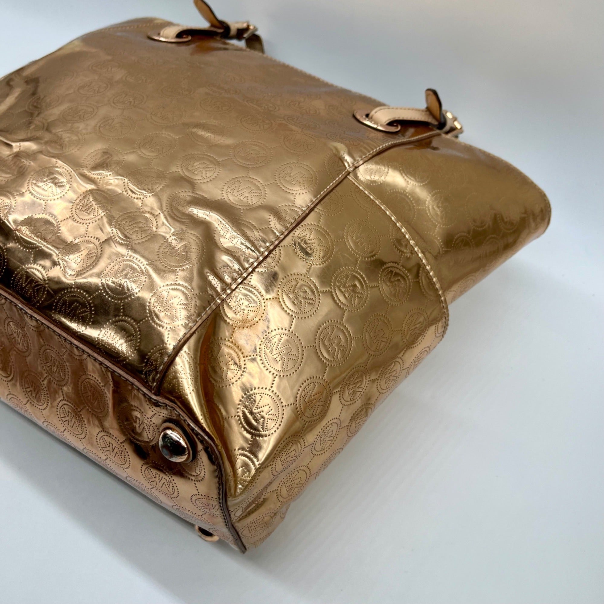 Michael Kors Metallic Rose Gold Embossed Signature Monogram Tote Bag