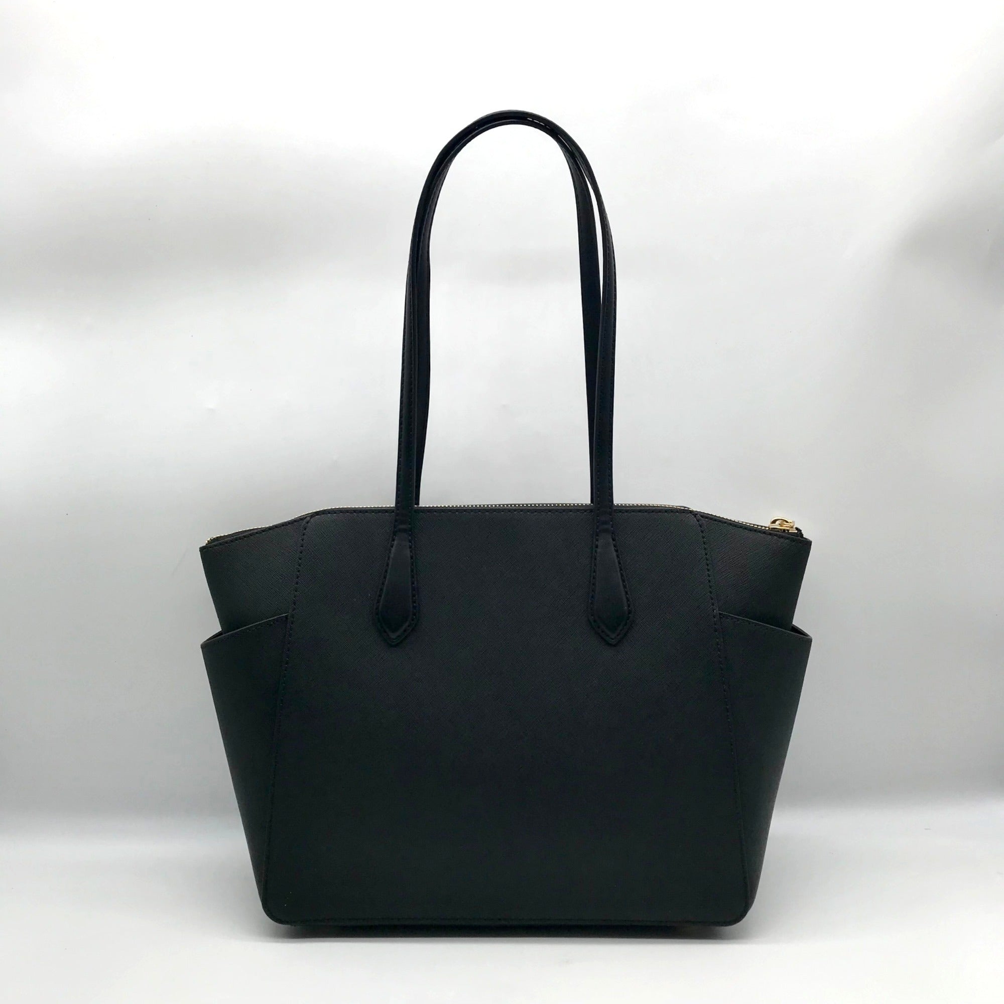Black handbag with a gold zipper on a white background