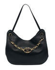 Black handbag with a gold chain detail on a white background