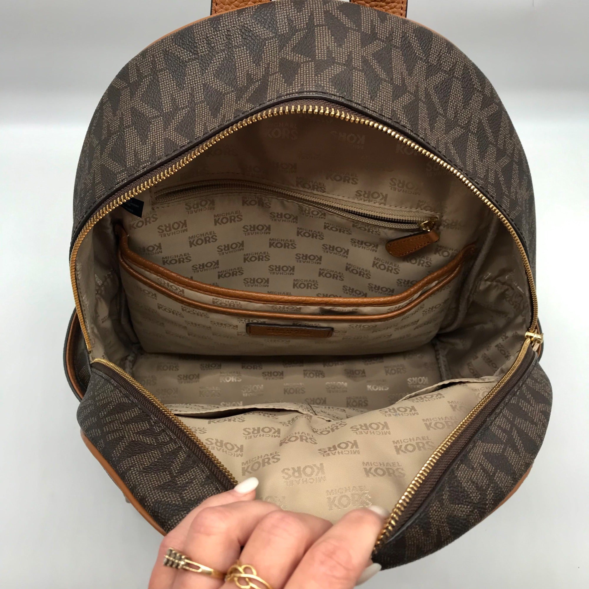 Michael Kors Brown Coated Canvas  Medium Abbey Backpack