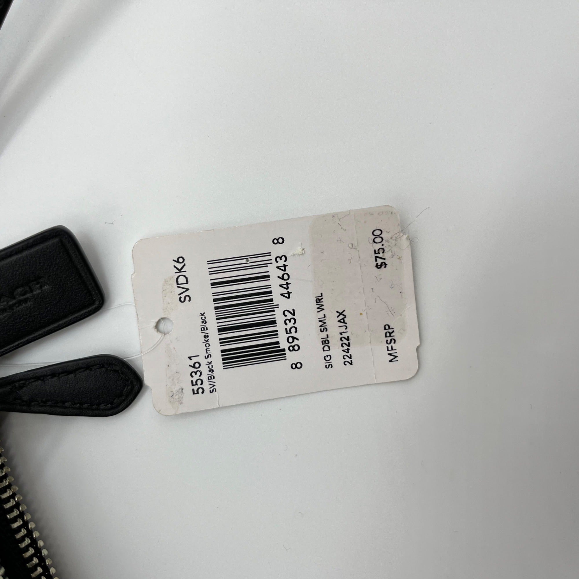 Tag with barcode and text on a white background