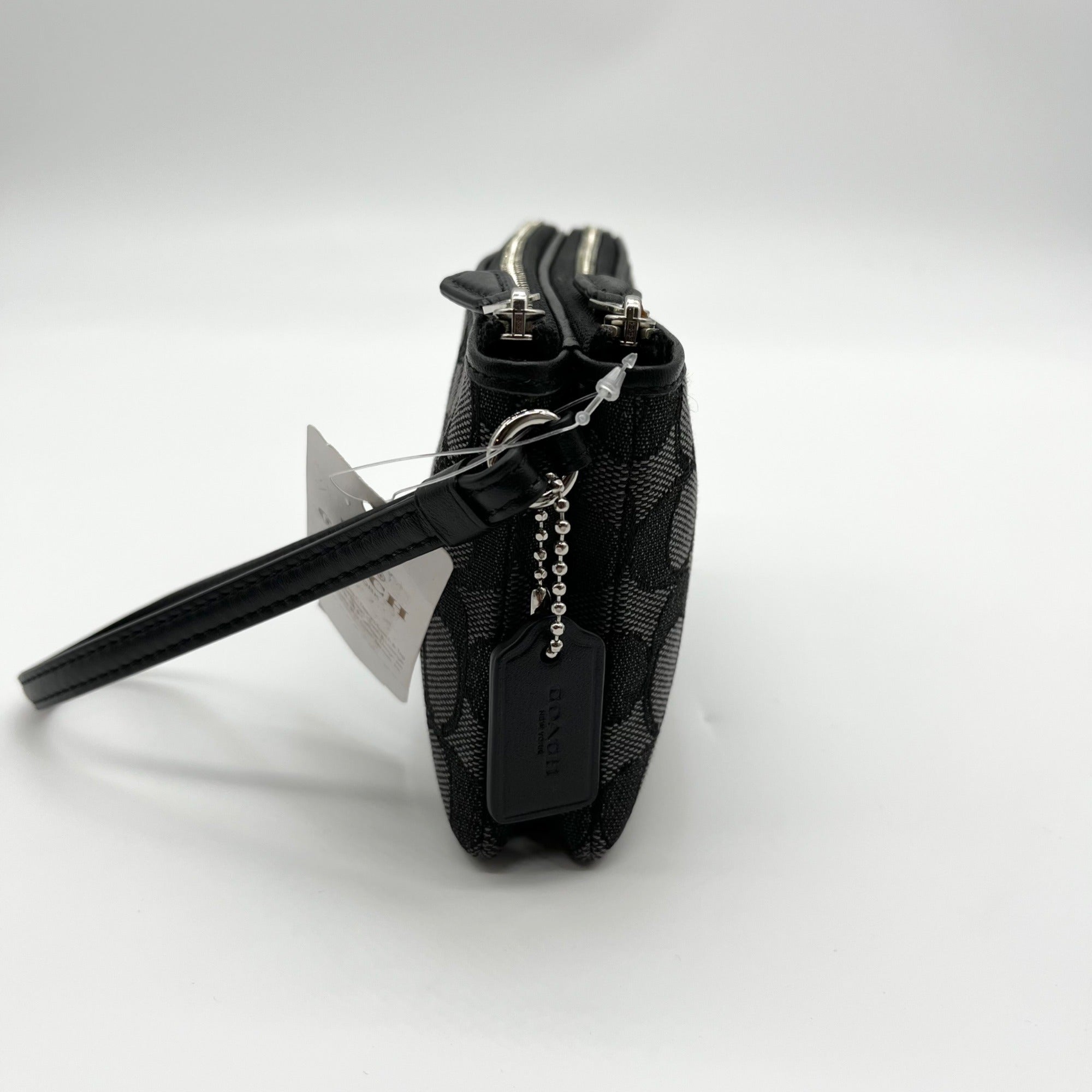 Black checkered wallet with a chain on a white background