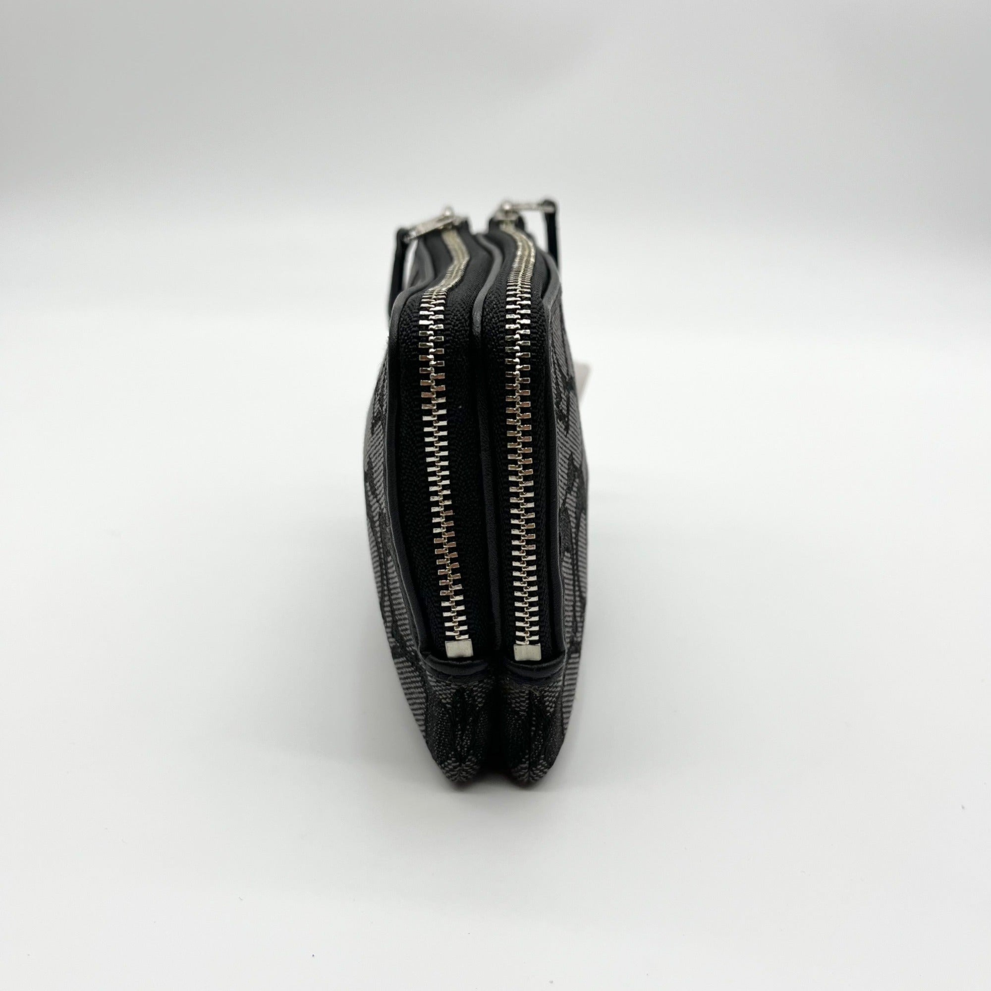 Black leather pouch with zipper on a white background